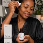 woman applying The Ordinary Vitamin C Serum for glowing, radiant skin at home in Nigeria.
