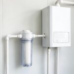 Water purifier for water heater setup showing a filtration system connected to a modern household water heater